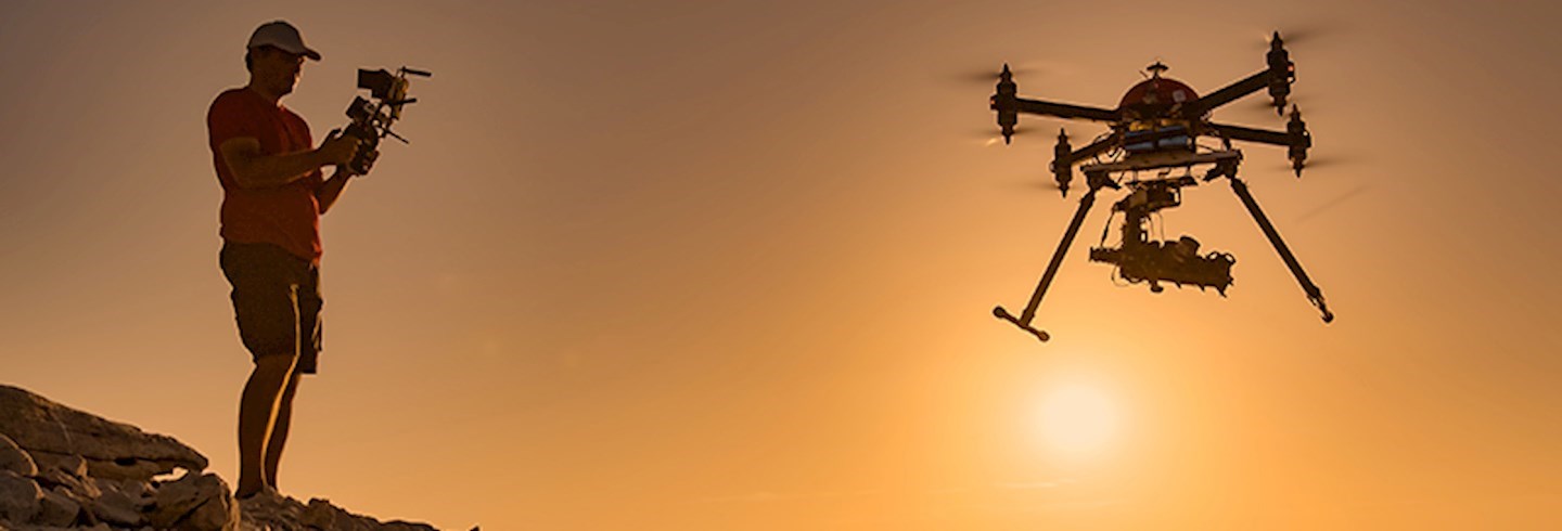 Man flying a drone outdoors