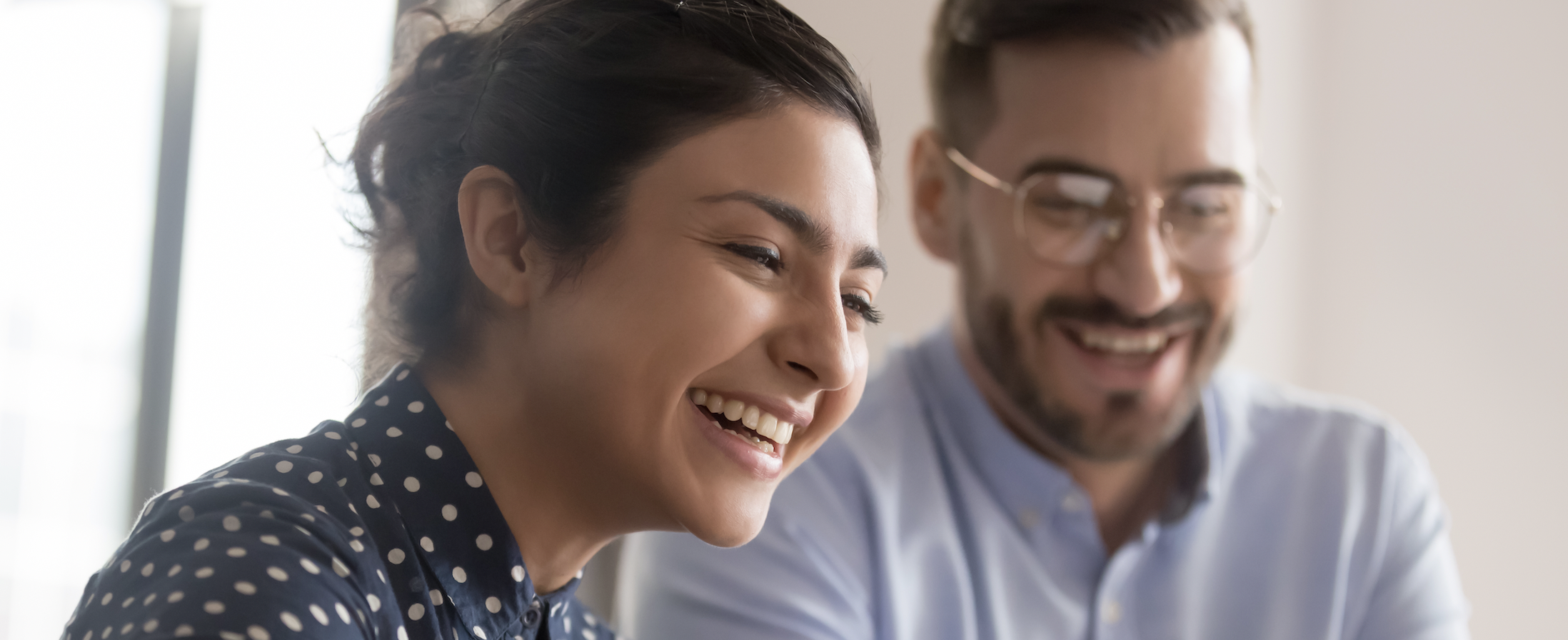People smiling in meeting