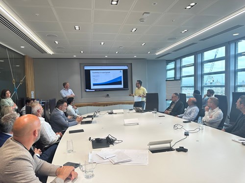 Image of TMK's Nirav Shah delivering results of the cyber hackathon to an audience of colleagues