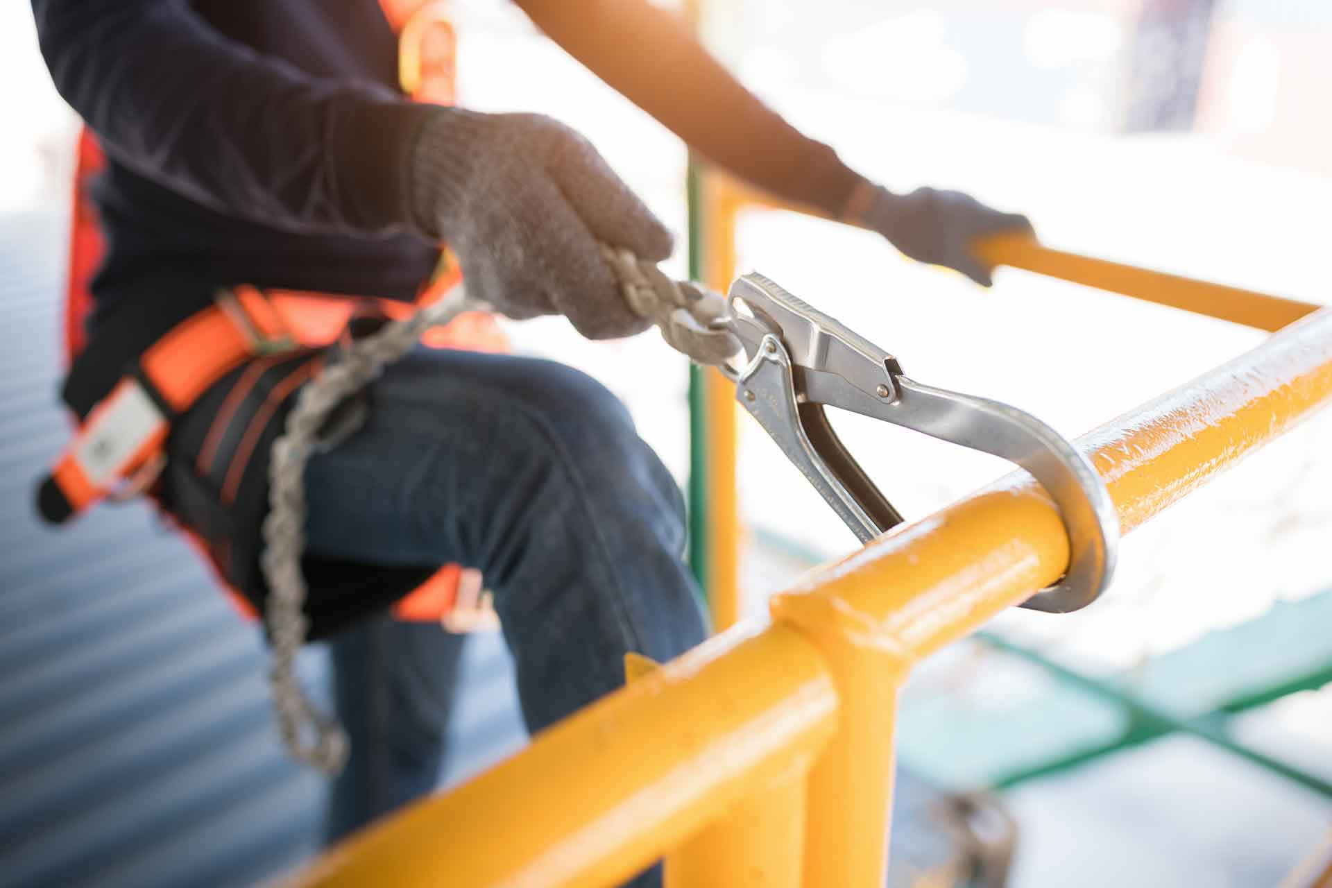 Worker attaching clip to rig