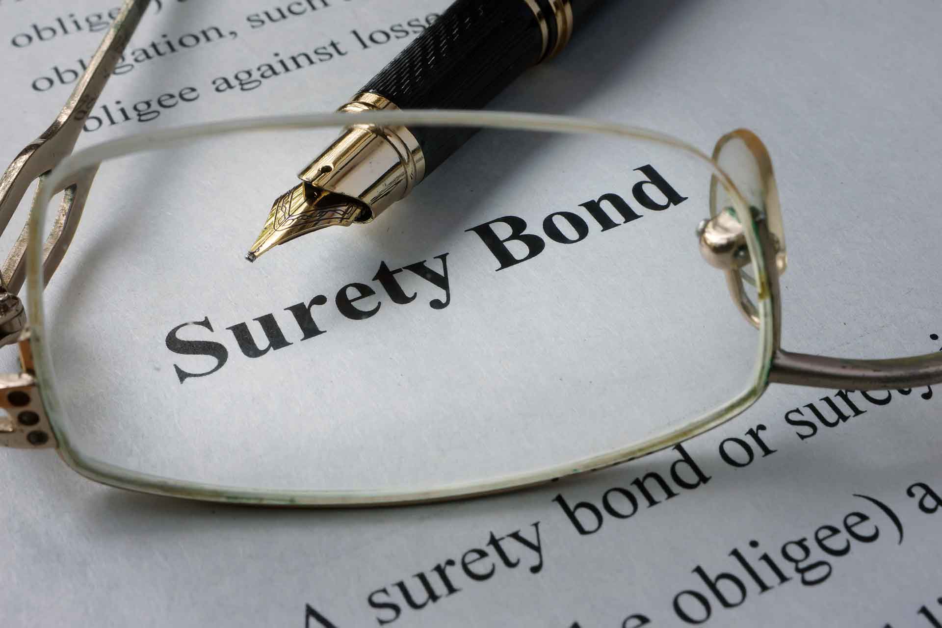 Surety bond paper and pen
