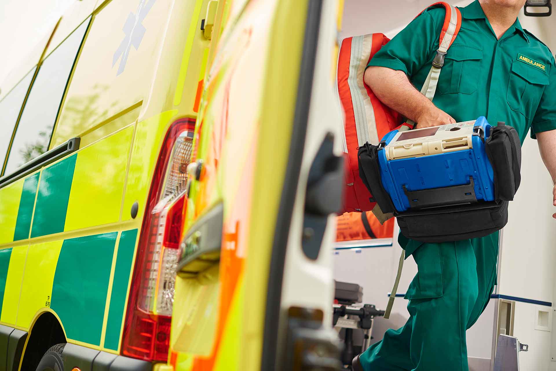 Abstract shot of ambulance and paramedic