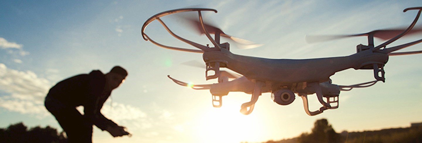 Man flying a drone outdoors